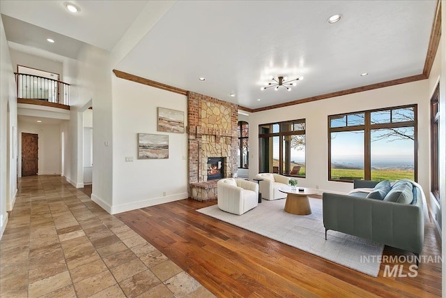 tiled living room featuring crown molding and a fireplace