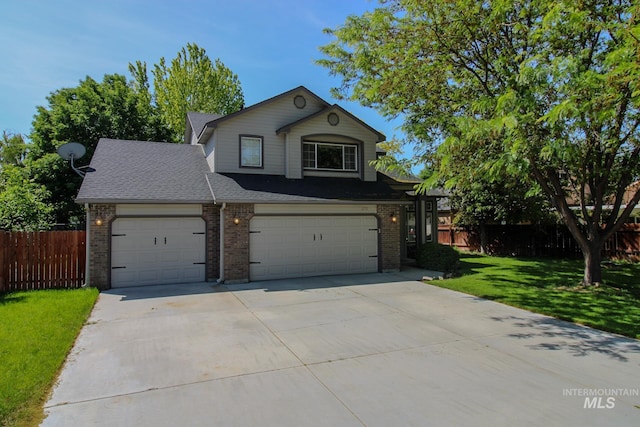 275 E Aruba, Meridian, ID 83642 - view of front facade featuring brick siding, driveway, roof with shingles, and a garage