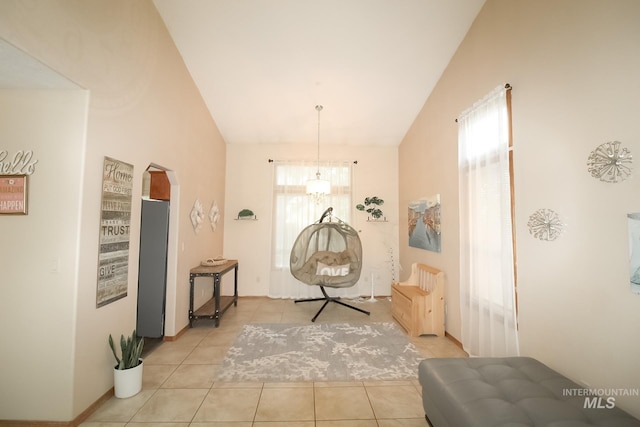 275 E Aruba, Meridian, ID 83642 - living area with lofted ceiling, light tile patterned floors, and baseboards