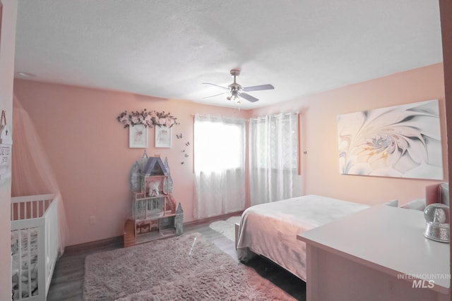 275 E Aruba, Meridian, ID 83642 - bedroom featuring wood finished floors, a ceiling fan, and baseboards