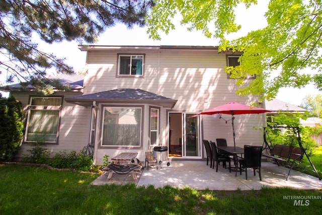275 E Aruba, Meridian, ID 83642 - rear view of house with a patio, a yard, and roof with shingles