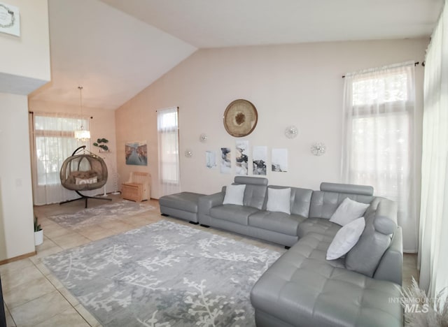 275 E Aruba, Meridian, ID 83642 - living area featuring light tile patterned floors and lofted ceiling