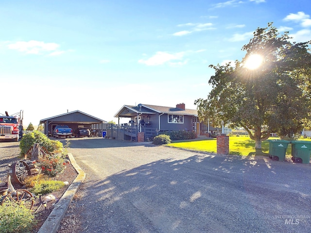 view of front of home with a garage and a front lawn