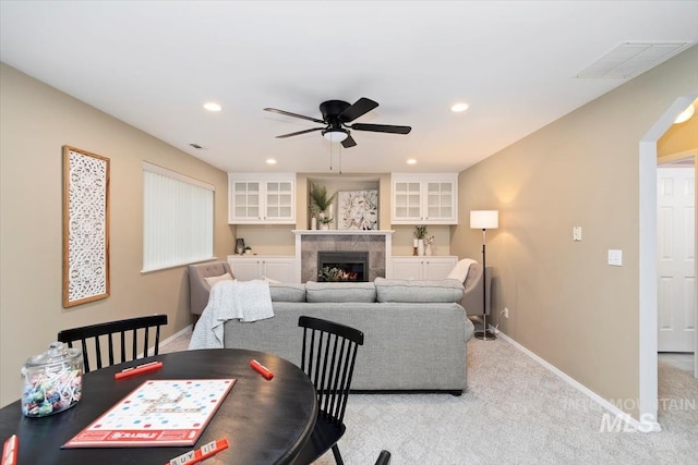 dining room featuring visible vents, recessed lighting, carpet flooring, baseboards, and a tile fireplace