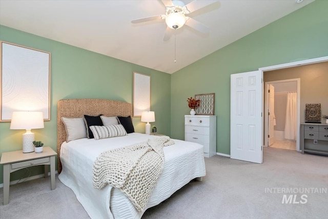 carpeted bedroom featuring ceiling fan and vaulted ceiling