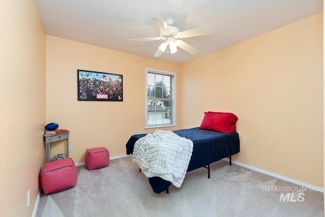 carpeted bedroom with baseboards and ceiling fan