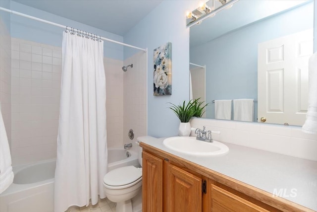 full bath featuring vanity, shower / tub combo, and toilet