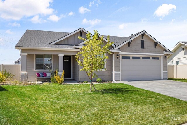 4875 N Glenrock Ave, Meridian, ID 83646 - craftsman-style home with fence, a front yard, concrete driveway, and an attached garage
