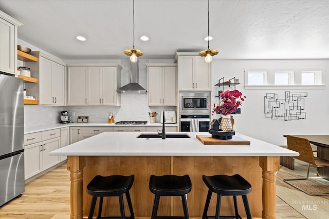 4875 N Glenrock Ave, Meridian, ID 83646 - kitchen with open shelves, light wood-type flooring, wall chimney exhaust hood, light countertops, and appliances with stainless steel finishes