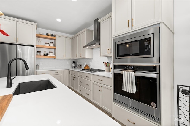 4875 N Glenrock Ave, Meridian, ID 83646 - kitchen with open shelves, appliances with stainless steel finishes, light countertops, wall chimney range hood, and a sink