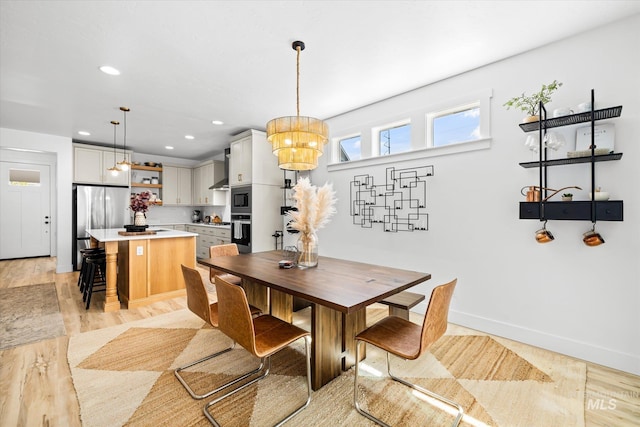 4875 N Glenrock Ave, Meridian, ID 83646 - dining area featuring light wood-style floors, recessed lighting, a notable chandelier, and baseboards