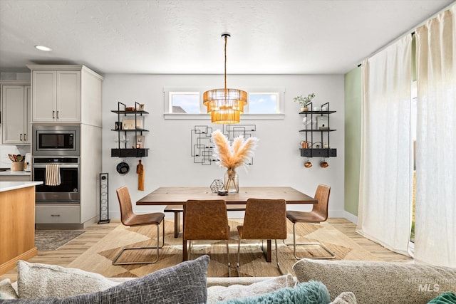 4875 N Glenrock Ave, Meridian, ID 83646 - dining area featuring a chandelier, light wood-type flooring, recessed lighting, and baseboards