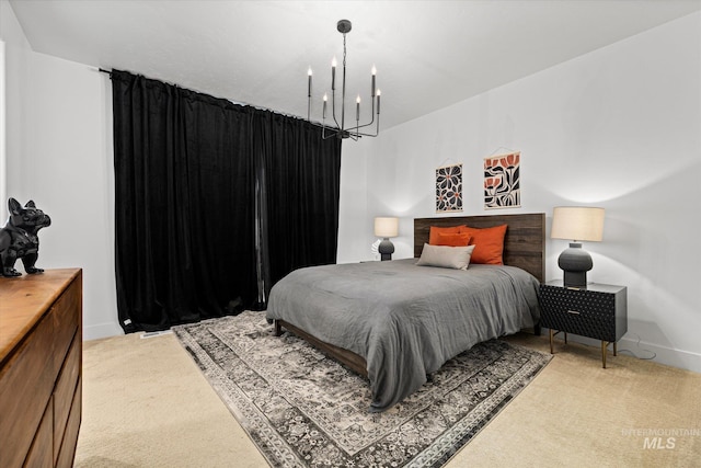 4875 N Glenrock Ave, Meridian, ID 83646 - bedroom featuring a notable chandelier, light carpet, and baseboards