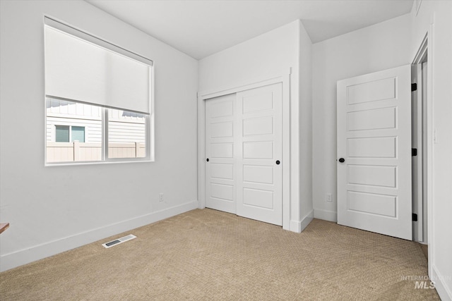 4875 N Glenrock Ave, Meridian, ID 83646 - unfurnished bedroom with visible vents, a closet, baseboards, and carpet floors