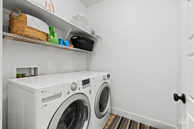 4875 N Glenrock Ave, Meridian, ID 83646 - clothes washing area featuring baseboards, separate washer and dryer, laundry area, and light wood finished floors