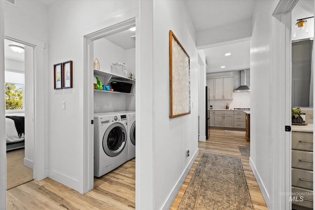 4875 N Glenrock Ave, Meridian, ID 83646 - washroom featuring light wood-style floors, baseboards, laundry area, and washing machine and dryer