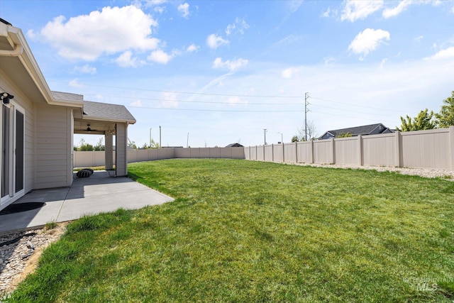 4875 N Glenrock Ave, Meridian, ID 83646 - view of yard with a ceiling fan, a fenced backyard, and a patio area