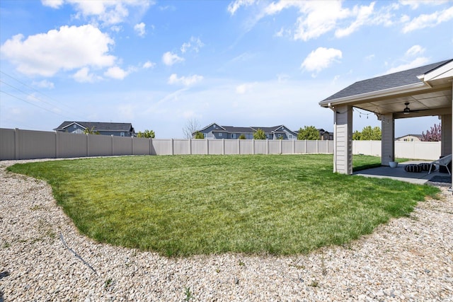 4875 N Glenrock Ave, Meridian, ID 83646 - view of yard featuring a patio, ceiling fan, and a fenced backyard