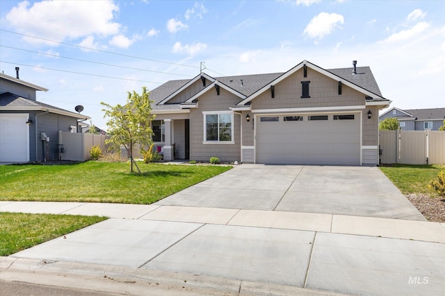 4875 N Glenrock Ave, Meridian, ID 83646 - view of front of house with fence, roof with shingles, a front lawn, concrete driveway, and an attached garage