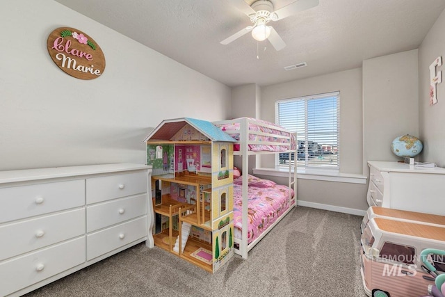 bedroom featuring baseboards, a textured ceiling, visible vents, and carpet flooring