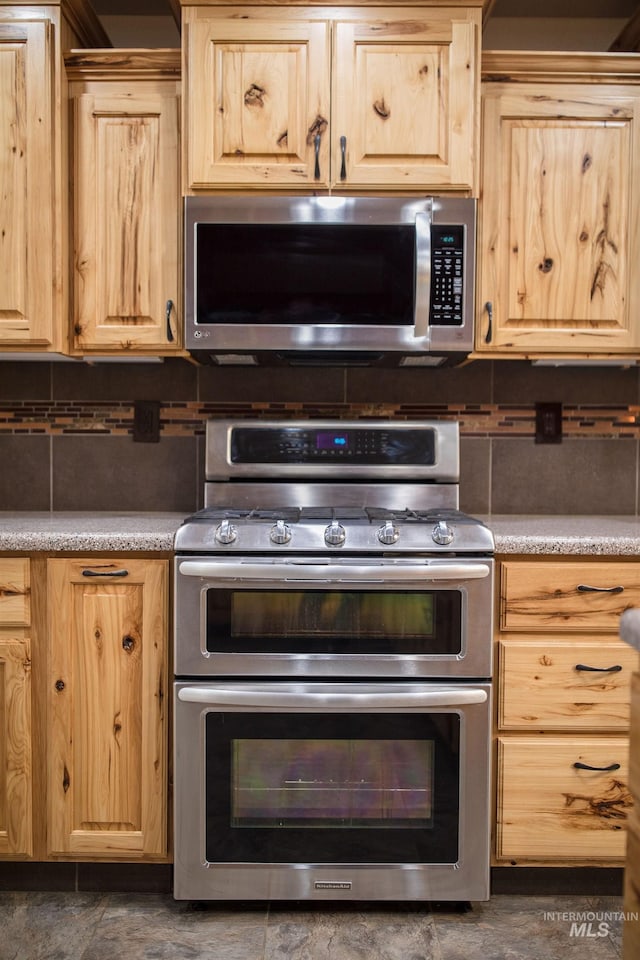 kitchen featuring appliances with stainless steel finishes and light brown cabinets