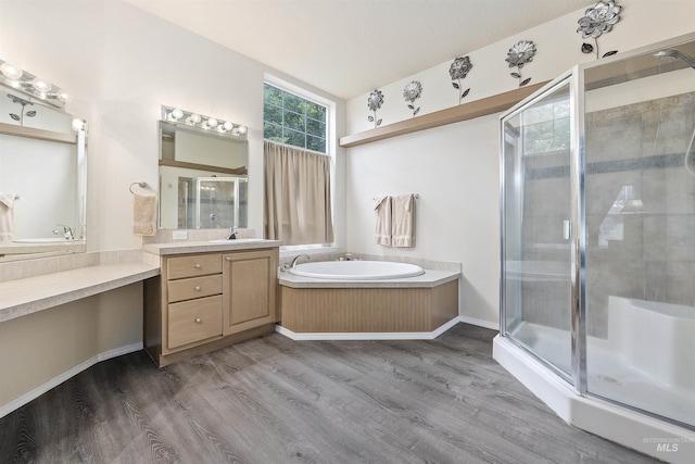 9788 Hwy 78, Hammett, ID 83627 - bathroom featuring a shower stall, a bath, wood finished floors, and vanity