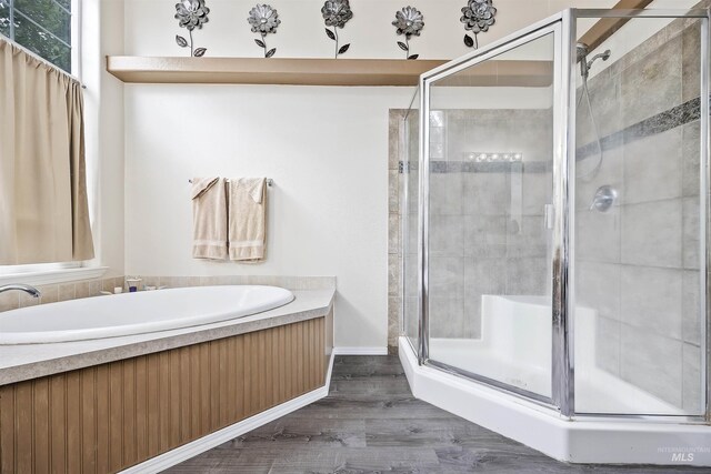 9788 Hwy 78, Hammett, ID 83627 - bathroom featuring a shower stall, a bath, and wood finished floors
