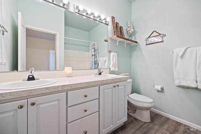 9788 Hwy 78, Hammett, ID 83627 - full bathroom featuring double vanity, a sink, toilet, and wood finished floors