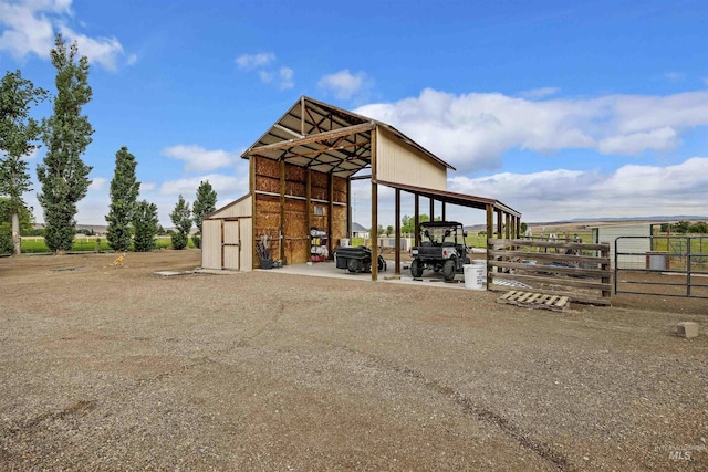 9788 Hwy 78, Hammett, ID 83627 - view of pole building with driveway, a detached carport, and fence