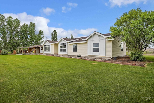 9788 Hwy 78, Hammett, ID 83627 - view of front facade featuring board and batten siding, a shingled roof, and a front yard