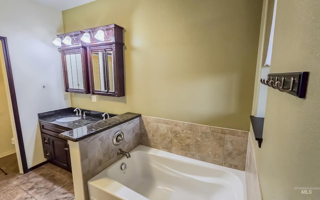 full bath with a garden tub and vanity