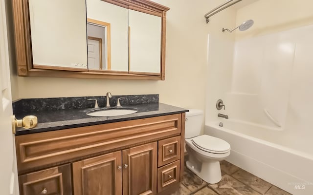 full bath with toilet, vanity, and bathing tub / shower combination