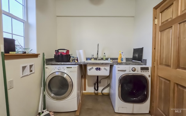 laundry room featuring washer / dryer and laundry area