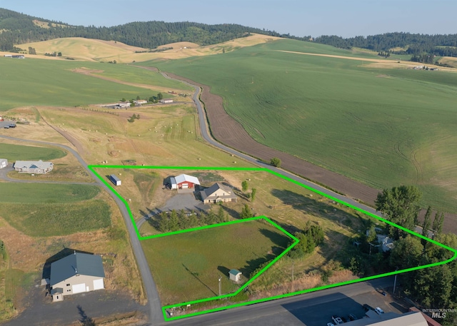 birds eye view of property featuring a rural view