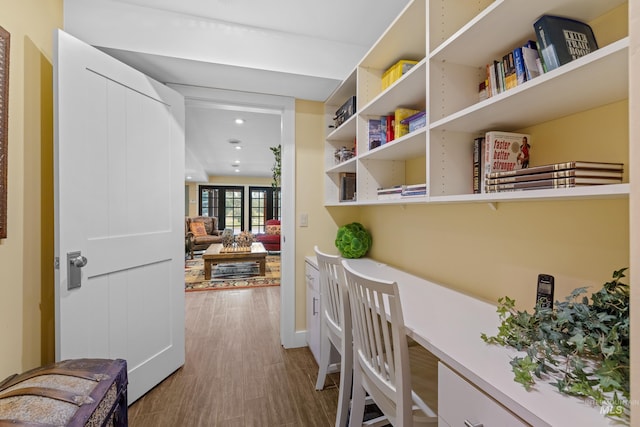hall featuring dark wood-style flooring and recessed lighting