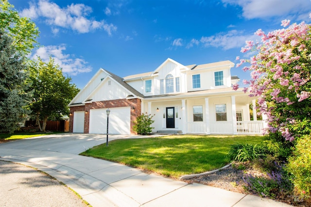 6174 N Queensbury Pl, Boise, ID 83713 - view of front of property featuring a porch, concrete driveway, a front yard, a garage, and brick siding