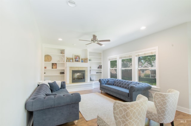 6174 N Queensbury Pl, Boise, ID 83713 - living room with a ceiling fan, a tiled fireplace, wood finished floors, recessed lighting, and baseboards