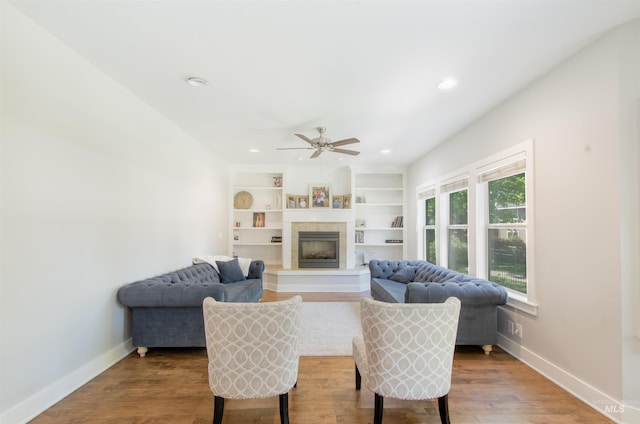 6174 N Queensbury Pl, Boise, ID 83713 - living room featuring baseboards, a ceiling fan, recessed lighting, a fireplace with raised hearth, and wood finished floors