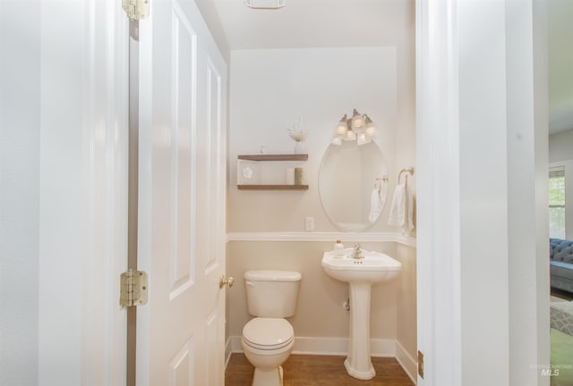 6174 N Queensbury Pl, Boise, ID 83713 - bathroom with toilet, baseboards, and wood finished floors