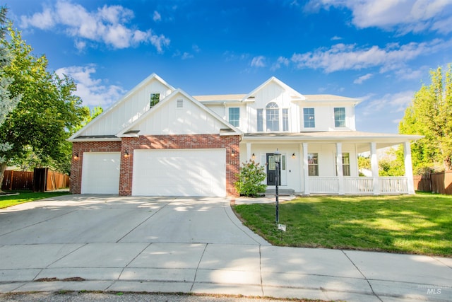 6174 N Queensbury Pl, Boise, ID 83713 - view of front facade with board and batten siding, a porch, an attached garage, brick siding, and concrete driveway