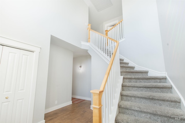 6174 N Queensbury Pl, Boise, ID 83713 - staircase featuring baseboards, wood finished floors, and a towering ceiling