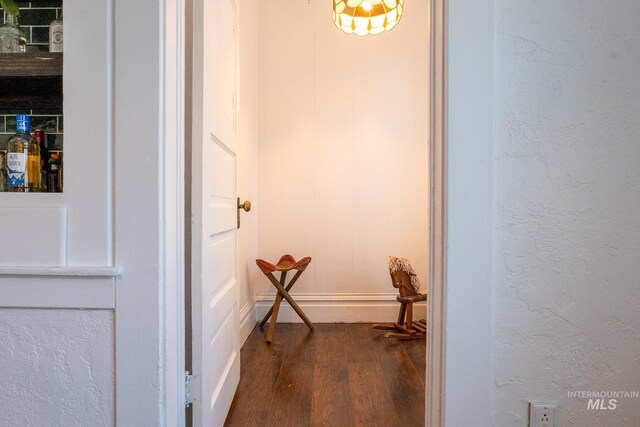 707 9th Ave S, Nampa, ID 83651 - hall with dark wood-type flooring and baseboards