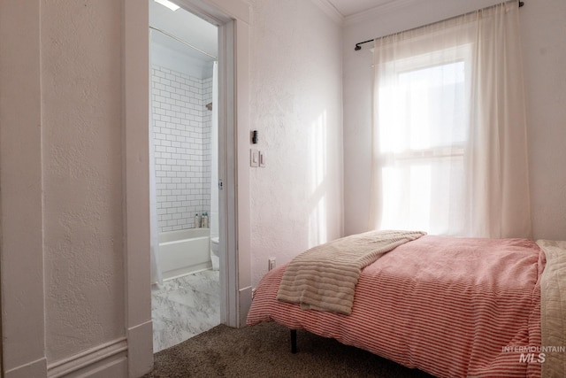 707 9th Ave S, Nampa, ID 83651 - bedroom with a textured wall, ornamental molding, ensuite bath, and marble look tile flooring