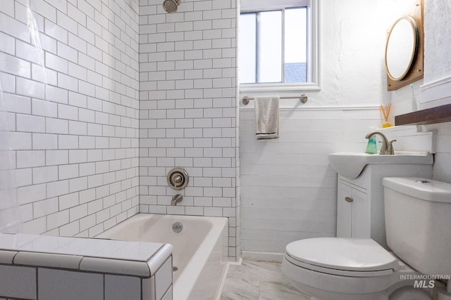707 9th Ave S, Nampa, ID 83651 - bathroom featuring toilet, marble look tile flooring, vanity, and bathing tub / shower combination