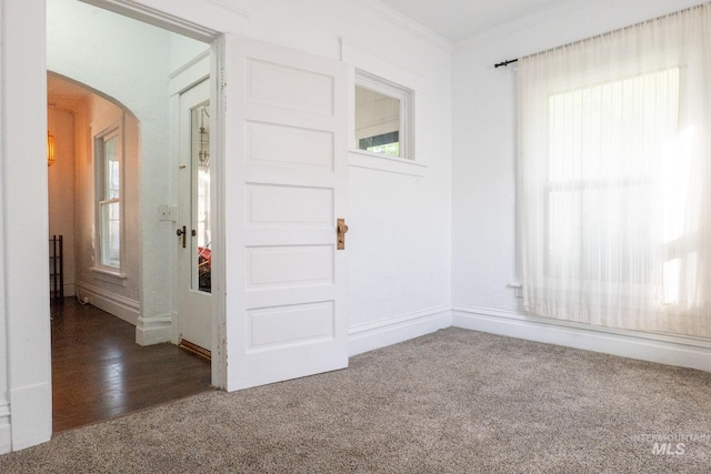 707 9th Ave S, Nampa, ID 83651 - empty room featuring carpet, arched walkways, crown molding, and baseboards