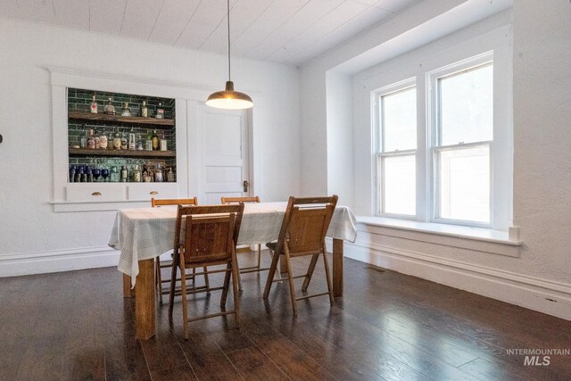 707 9th Ave S, Nampa, ID 83651 - dining area featuring wood finished floors, baseboards, and built in features