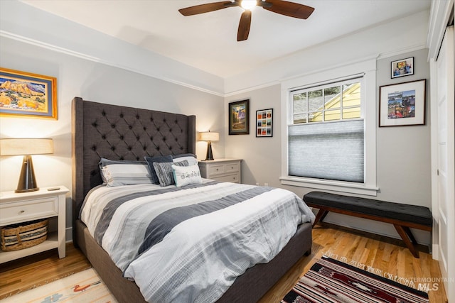 bedroom with light wood-style flooring and ceiling fan