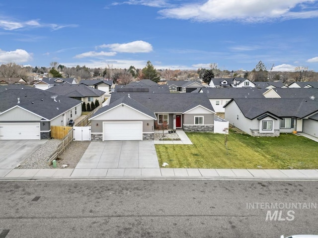 view of front of home featuring a garage and a front yard