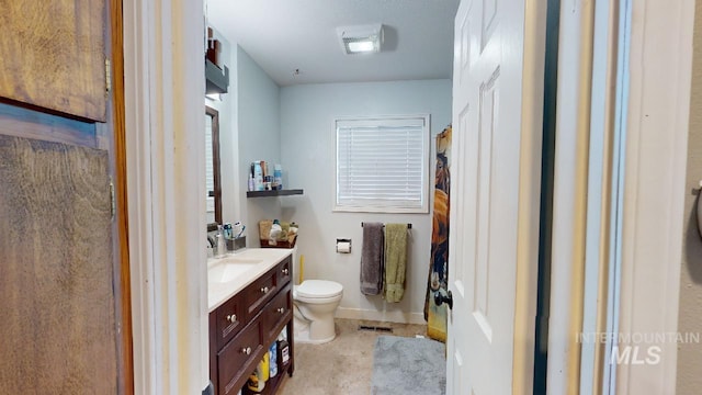 full bathroom featuring baseboards, visible vents, vanity, and toilet