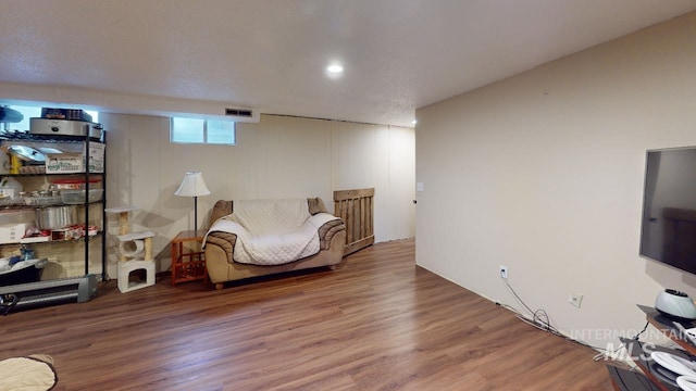 bedroom with visible vents and wood finished floors